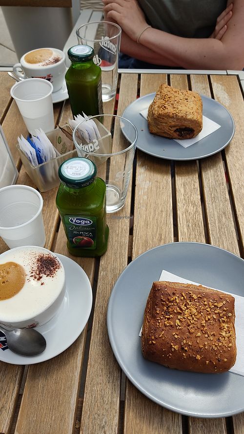 Vegan breakfast, chocolate pastry, cappuccino, peach juice at Shebar in Pompei