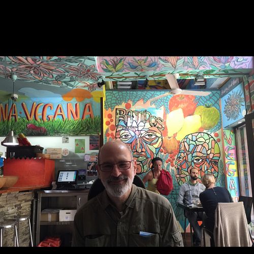 Ron Shaheen ready to eat yummy food inside seating at Veggie Garden - Dels Angels in Barcelona