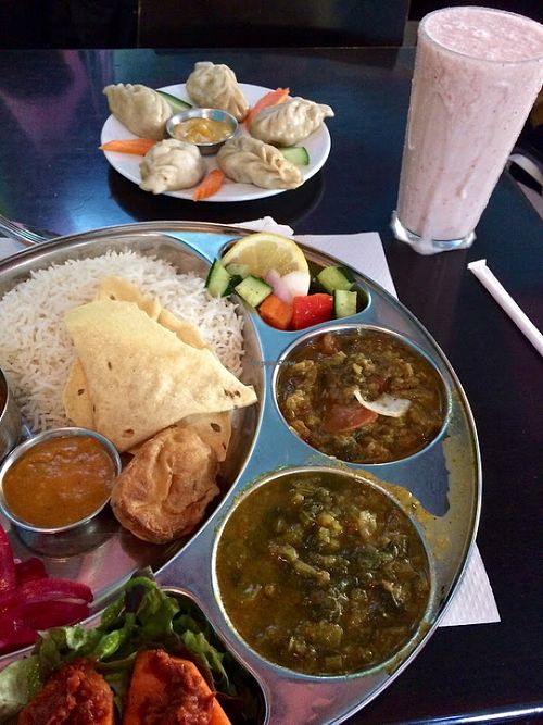 "Luxury Thali," momo, and strawberry-banana smoothie at Veggie Garden - Dels Angels in Barcelona