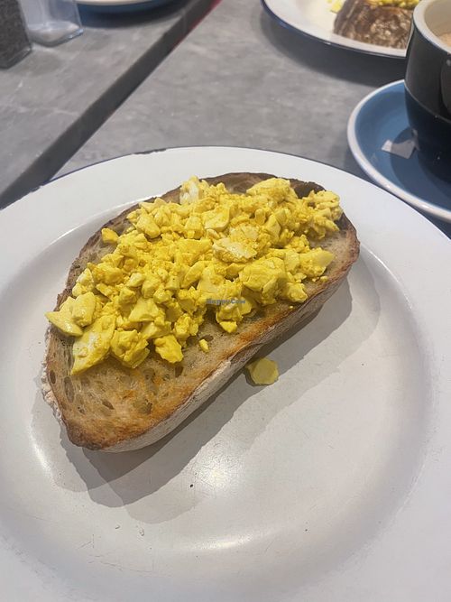 This is how it’s served, the scramble doesn’t even cover surface of the bread 🙈  at Bluebelles of Portobello in West London