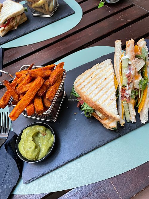 Club sandwich with sweet potato fries and guacamole. at Ma'Rinas - Veggiezz in Karlsruhe