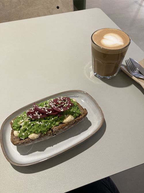 Smashed pea and avocado toast with cappuccino   at Vital Foods in Copenhagen