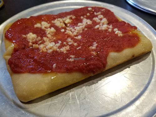 Undercooked crust, raw garlic and oil. at Via 313 Pizza in Cedar Park