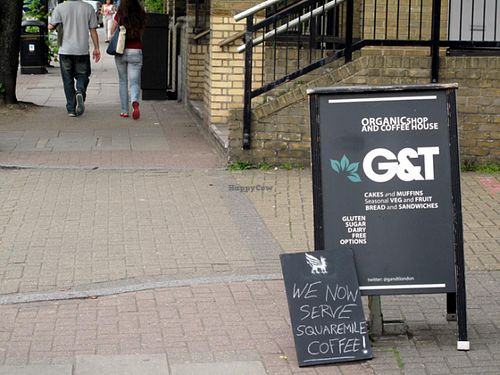 walking along Cambridge Heath Road at G and T Coffee House in East London