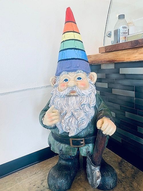 Cute gnome mascot with a rainbow cap at Cup & Crêpe in Everett