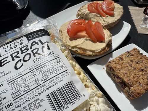 Little lad’s herbal corn, hummus bagel and "granola bar”  at Elements: Books Coffee Beer in Biddeford