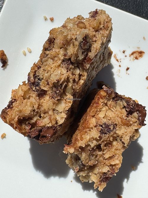 Inside of the granola bar.  You can see it’s got a cakey binder rather than sticky binder.  Much more of a flapjack than a granola bar.  Both raisins and chocolate chips. Yum!  at Elements: Books Coffee Beer in Biddeford