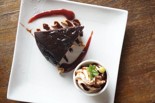 Chocolate cake with vegan soft serve. at Vegans Cafe and Restaurant in Kyoto