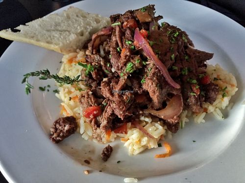 Seitan in ";beefy"; sauce with mushrooms and veggies on rice pilaf.  at Crane and Pelican in Le Claire