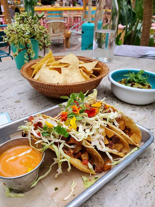 Vegan tacos, chips and guacamole   at De Buena Planta in Los Angeles