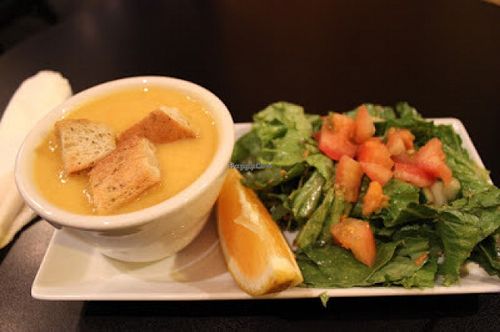 Course 1: Vegan squash soup with croutons and side salad. at End of the Line Cafe in Pensacola