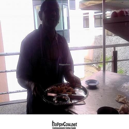 the owner and his roti canai/paratha  at Cafeteria Hospital Sultan Abdul Halim in Sungai Petani