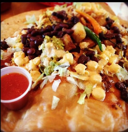 This special's called 'Flying Saucer Full of Secrets.' A Mexican breakfast pizza w/ organic scramble, hash potatoes, chorizo, enchilada sauce, hominy corn, black beans, lettuce, & guac on a fried tortilla (avail w/ cheese & sour cream, but I omit it) at nami Vegan Sweets in Phoenix