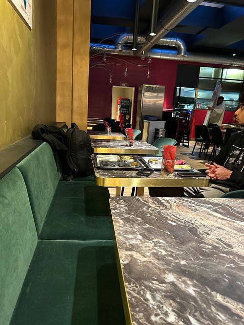 Kitchen in background   at Saravanaa Bhavan in Cologne