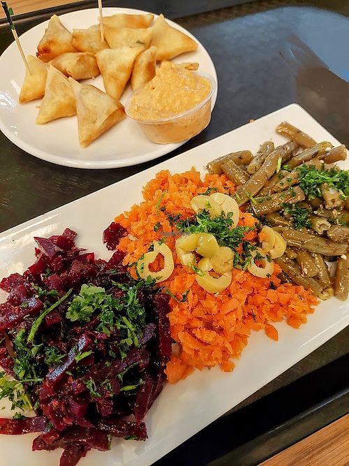 Mini samosa & veggie platter. Make sure to get hummus as a sauce for samosas; white sauce has yogurt. Southern Market location at Flavors of Morocco - Southern Market in Lancaster