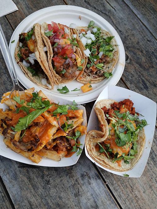 Fish taco, chicken, al pastor, and stuffed jalapeno.  Also, a side of the loaded duck fries. at Nepantla in Detroit