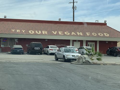 Side vegan food sign on restaurant roof at Taste of India in Buttonwillow