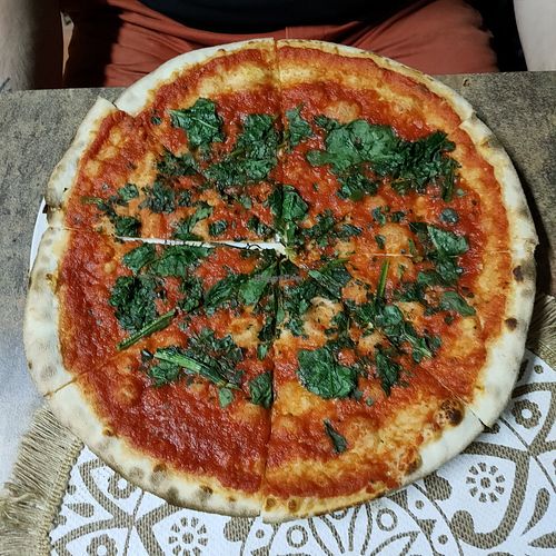 Spinach pizza at Pizzeria Bella Italia in Himare