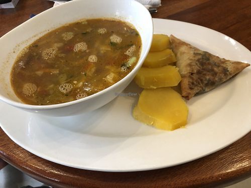 Detox cabbage soup full of fresh veggies and with sweet potatoes and samosa at Bridges Organic Health Restaurant in Nairobi