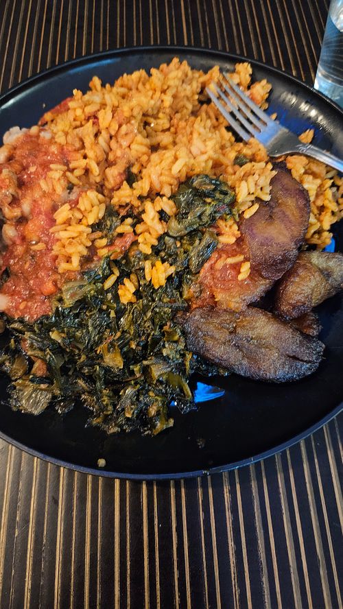 Vegan jollof rice, vegan spinach stew with beans, and plantains  at The Village PVD in Providence
