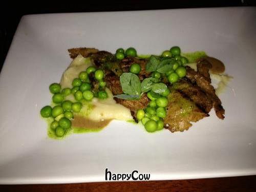 grilled seitan, creamy turnips, beech mushrooms, English peas, and truffle mustard at Vedge in Philadelphia