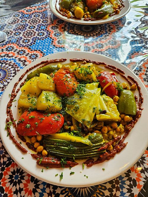 Veggie dish on couscous- INCREDIBLE layered flavor and filling! at Kasbah Moroccan Cafe in Portland