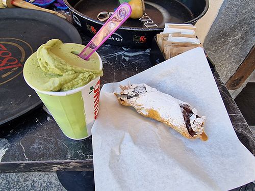 Large pistachio granite with chocolate cannoli, both vegan at Bar Mazzini in Catania