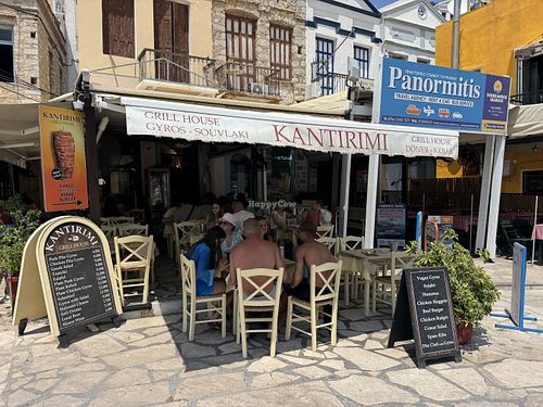 Outside - note available tables for 2 - refused to seat me   at Kantirimi Grill House in Symi