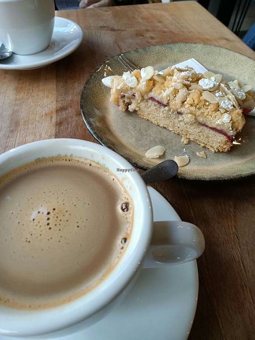 Coffee with oat milk & strawberry almond cake. at Wild&Wood in Wiesbaden