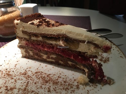 Carob cake with strawberries and banana (vegetarian)  at Vegafe - Augustijonu Str. in Vilnius