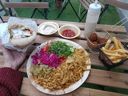 Shawarma plate, shawarma pita, chips, falafel, hummus at Falafel Sumsum in Tel Aviv