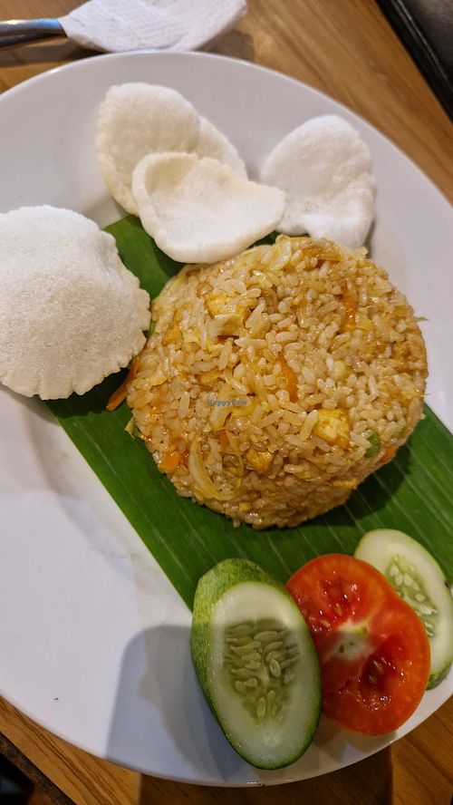 Nasi goreng. The crackers are made with wheat and garlic at Firda Warung in 