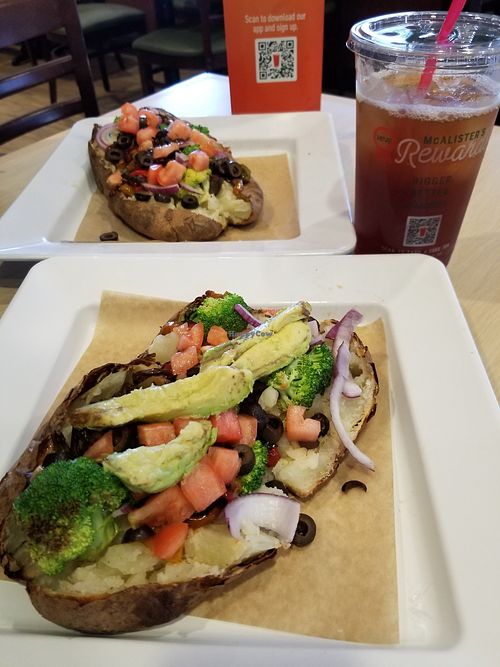 Justaspud with all the free toppings plus avocado on the front one. at McAlister's Deli in Cedar Park