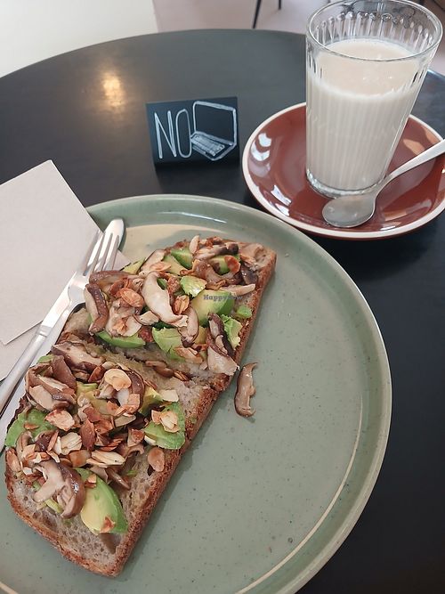 Avocado and mushroom toast + glass of oat milk at OBBA Café in Almada