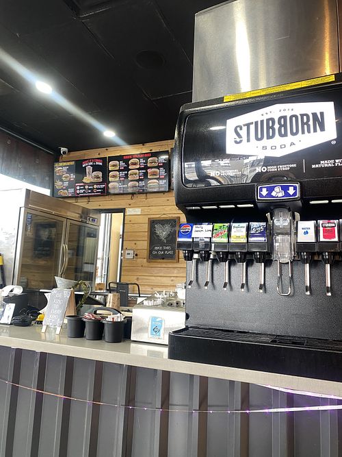 Register Area w/Fountain Drink Machine w/Sign That Reads “Peace Starts on Your Plate” 🌱🫶🏽  at Nice Burger in Long Beach