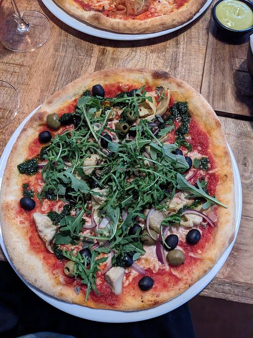 Arti joking me pizza at Vegan Pizza Bar in The Hague