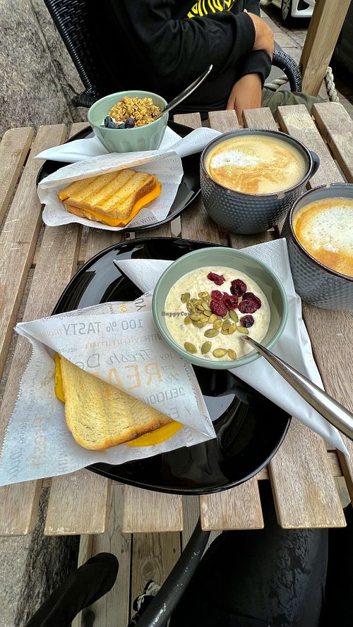 Yoghurt, over night oats, pepperoni sandwich, peanut butter & smoked cheese sandwich, oat lattes. All vegan!   at Encanto - Art Cafe in Helsinki