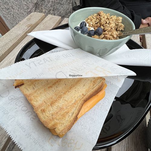 Pepperoni sandwich and yoghurt with granola.  at Encanto - Art Cafe in Helsinki