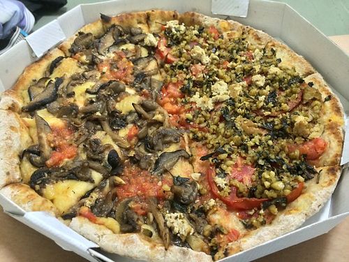 Half "vegan wild mushrooms" and half "vegan pesto" at Francesca Pizzaria - Vila Planalto in Brasilia