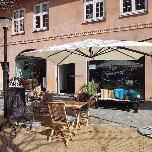The café  from the outside, showing the outdoors seating area at Café Hyggestund' in Birkeroed