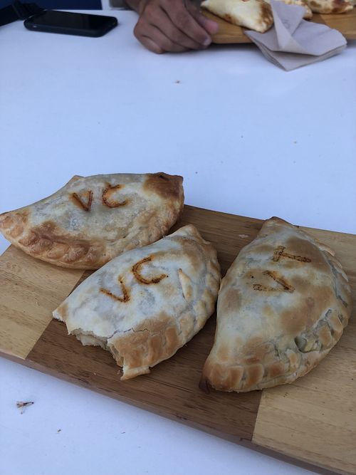 Empanadas veganas de cebolla y de tomate-mozzarella  at El Cafè De La Mirta in Barcelona