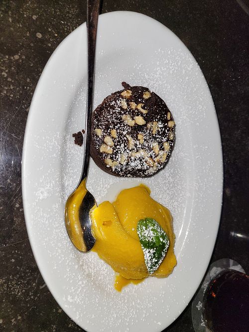 Warmes Schokoküchlein mit Maracuja-Sorbet. Köstlich! at L'Osteria in Bielefeld