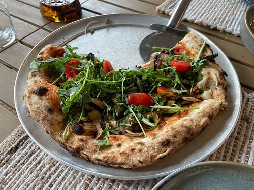 Greta with delicious vegan cheese and one of the best crusts I've ever had.  at GRAVA in Pals