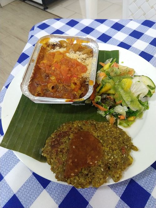 Quinoa pasta with tomato sauce, salad, lentil patty at Vida y Salud in Cali