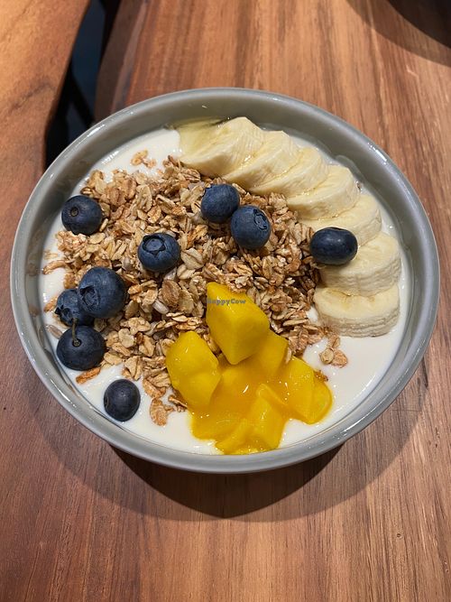 Our breakfast bowl with natural or soy yoghurt, "Neue Weberei" cereal mix, berries, banana, nuts and mango. at Neue Weberei in Wernau
