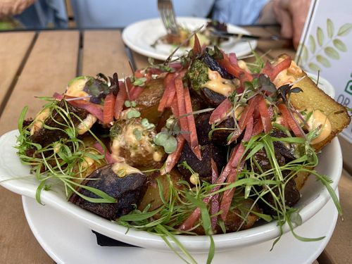 PATATAS AZULES  on the snacks menu. Big enough for an entrée! Fantastic!
fried blue gem potato, chili toum, ramp chimichurri, pickled daikon, pickled carrot, amaranth microgreens  at Jardin in Madison