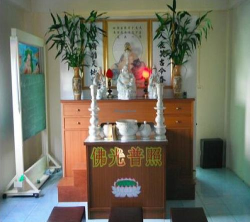 Buddhist shrine upstairs. at Mae Orathai Vegetarian in Phuket