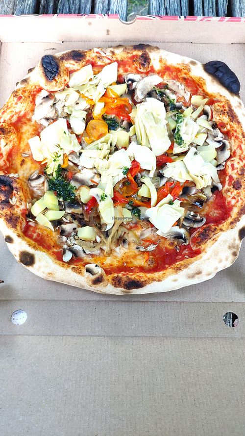 Pizza Vegan with tomato, potatoes, mushrooms, peppers, caramelized onions, artichokes and parsley at Le Moulin Des Saveurs in Argentan