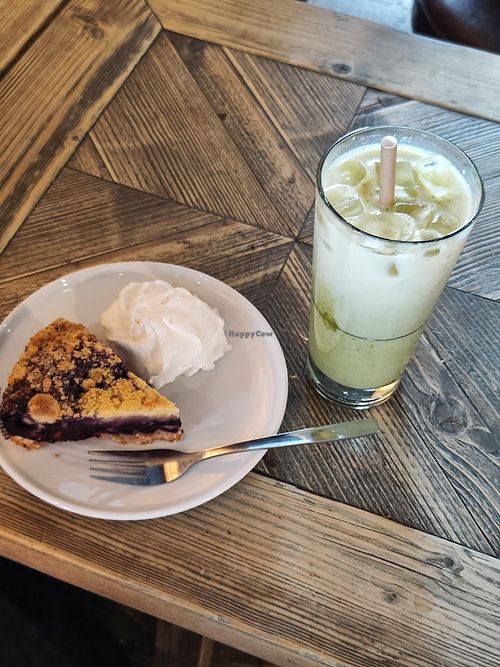 Blueberry pie with vegan cream, and iced vanilla soy matcha at Espresso House in Molde