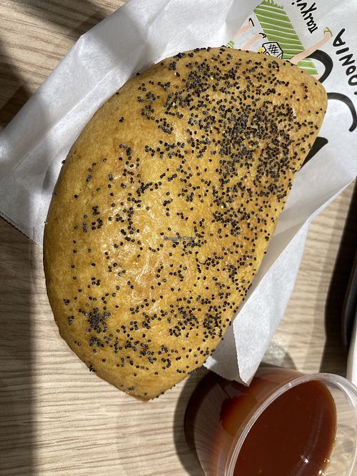 vegan cheese pie (sauce does not come with it, we ordered extra ketchup)  at ATH - Gregory's - Departures in Athens